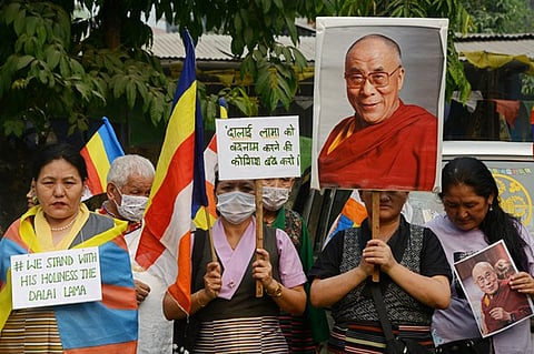 Members of the Tibetan and Buddhist communities take part in a protest march and a prayer ceremony in support of the Tibetan Buddhists' spiritual leader, the Dalai Lama, on the outskirts of Siliguri, India.