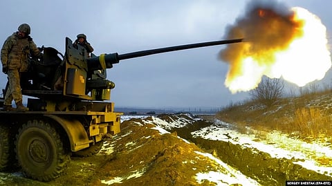 Ukrainian soldiers fire from an antiaircraft gun at Russian positions near Bakhmut in the Donetsk region,Ukraine
