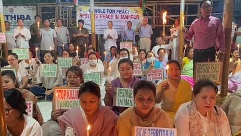 Manipuris in Tripura hold candlelight demonstration seeking normalcy in home state