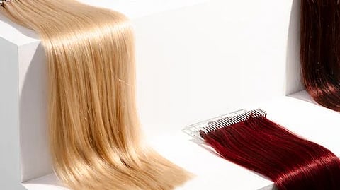 Invest in high-quality hair extensions right from the beginning. Remy human hair extensions are considered the best option as they are made from real human hair and designed to mimic your natural locks. (Unsplash)