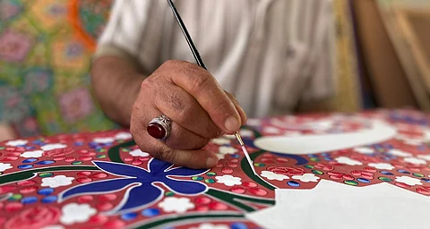 Gently stroking the vibrant canvas with a pointed paintbrush, Nowsheeba Mushtaq (18) talks about her tryst with Kashmiri paper mache.