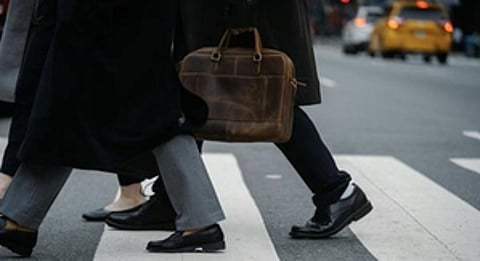 Layer Smartly: Layering is the key to staying warm without compromising your professional image. Start with a thermal or silk base layer to trap heat close to your body. (Wikimedia commons)