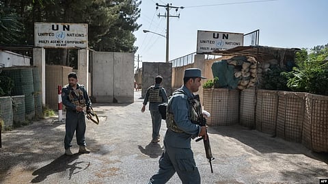 FILE - Security personnel stands guard outside United Nations Assistance Mission in Afghanistan (UNAMA) office compound in Guzara district of Herat province on July 31, 2021. VOA