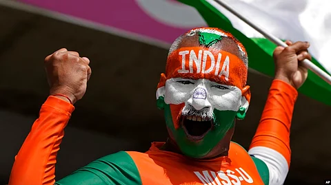 An Indian supporter cheers for his team ahead of the ICC Men's T20 World Cup cricket match between Afghanistan and India at Kensington Oval in Bridgetown, Barbados. VOA