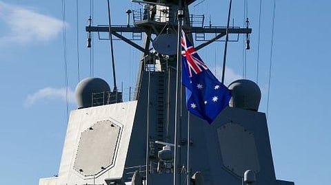 Australian flag flying on a naval ship.