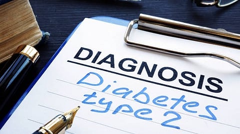 Clipboard with a paper labeled “Diagnosis” and handwritten words “Diabetes type 2.