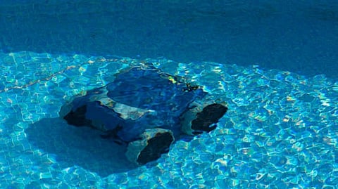 Underwater rocks seen through clear blue water