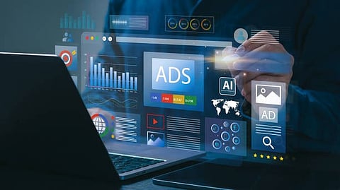 Laptop screen displaying digital advertising and analytics dashboards with graphs and “ADS” text.