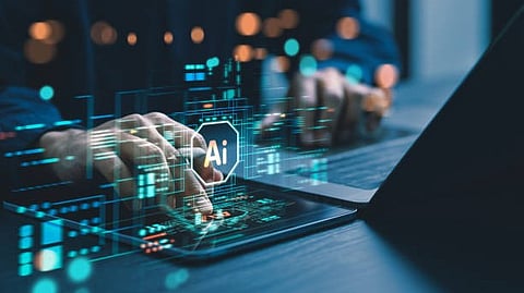 Hands typing on a laptop keyboard with a digital overlay showing the letters "AI" and various technological icons, suggesting artificial intelligence or tech innovation.