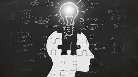 image of a person holding a light bulb, symbolizing an idea or inspiration.