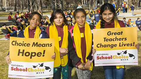 Students holding signs during National School Choice Week