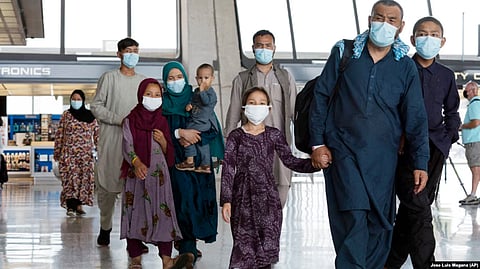 Families evacuated from Kabul arrive at Washington Dulles International Airport in 2021.