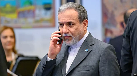 Iran Foreign Minister Abbas Araqchi talks on his mobile phone during the 51st session of the Council of Foreign Ministers of the Organization of Islamic Cooperation (OIC) in Istanbul on June 21, 2025.