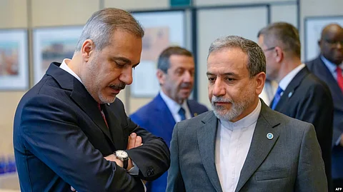 Iranian Foreign Minister Abbas Aragchi (right) speaks with Turkish counterpart, Hakan Fidan, in June. Iran says it will meet with European powers in Istanbul on July 25.
