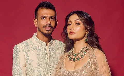 In the image cricket start Chahal is posing with the youtuber Dhanashree verma