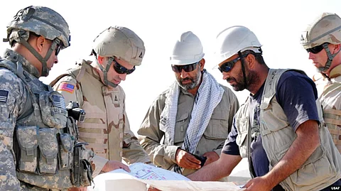 in the image Afghan engineers and Afghan army is shown discussing in a topic.