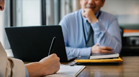 In the image a person is shown interviewing other