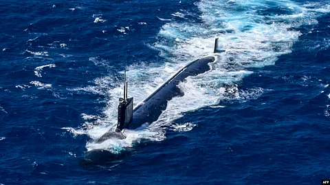 In the image US nuclear submarine is shown going underwater
