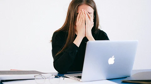 Employee being stressed in her workplace.