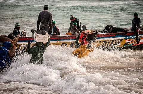 many fishing boats in the shallows, to buy the fresh fish