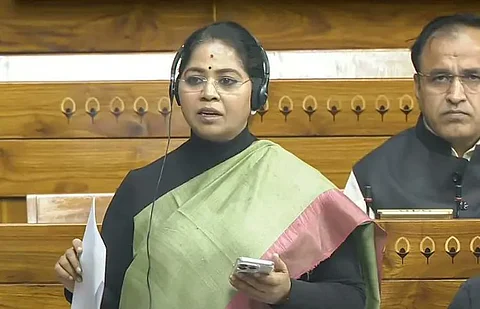 In the image sudha is shown addressing the parliament