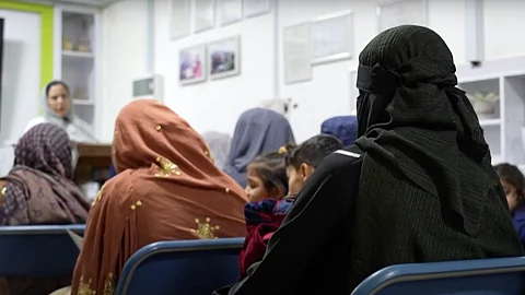 Afghan women attend a midwifery course before it was shut down by Taliban forces