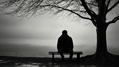 A depressed man sitting