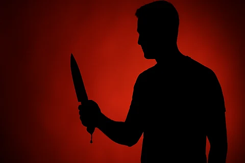 Image of man holding a knife which was also used in the Delhi triple murder case