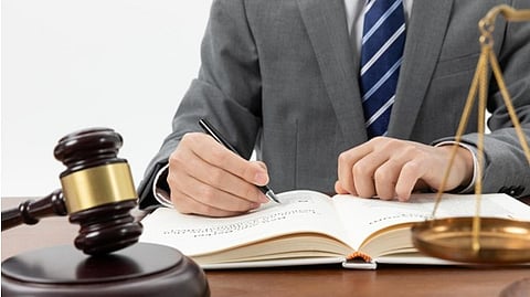 Lawyer writing papers.