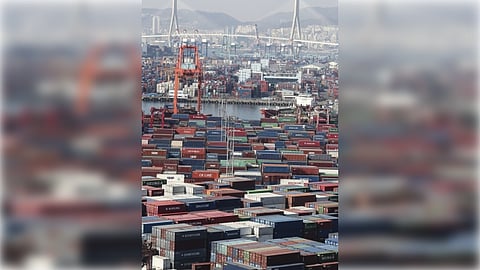 Containers for exports and imports are stacked at a pier in South Korea's largest port city of Busan on Feb. 11, 2022. South Korea's exports fell 12.6 percent on-year in the first 10 days of February due to fewer working days over the Lunar New Year holiday, according to data from the Korea Customs Service