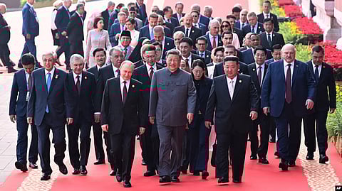 Chinese President Xi Jinping (center) and foreign leaders including Russia President Vladimir Putin (center left) and North Korean leader Kim Jong Un (center right) walk to Tiananmen Rostrum ahead of a ceremony to commemorate the 80th anniversary of the end of World War II.