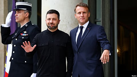 Ukrainian President Volodymyr Zelenskyy (left) meets French President Emmanuel Macron as they arrive for a meeting of the so-called Coalition of the Willing to discuss post-war security guarantees for Kyiv on September 4.
