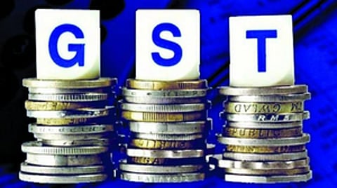 GST blocks and coins.