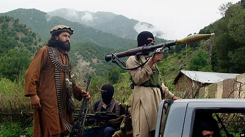 Members of the Pakistani Taliban patrol Shawal in the Pakistani tribal region of South Waziristan in August 2011.