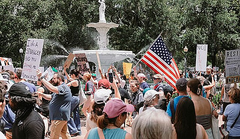 A group of protesters with the American Flag.