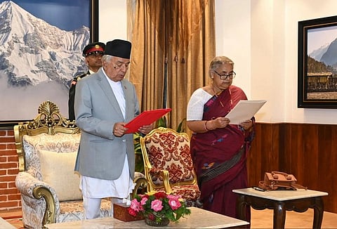 Image of Nepal's PM Karki taking Oath.