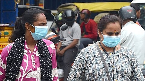 Bengaluru: People wear face masks as a precautionary measure against the coronavirus pandemic, in Bengaluru on Tuesday, May 27, 2025.
