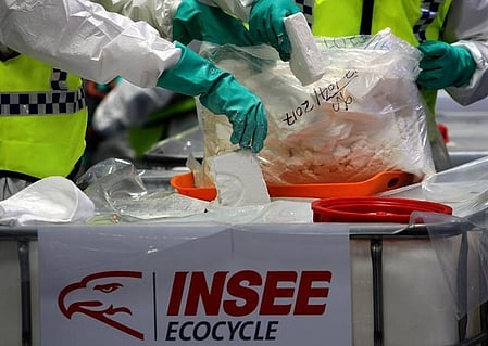 Law enforcement agents check the seized cocaine to be destroyed in a suburb of Colombo, Sri Lanka, April 1, 2019.