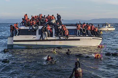 Refugees arriving at the Greek island of Lesbos.