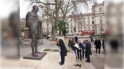The plinth of the bronze statue, which portrays Gandhi in a seated meditative posture, was found covered with offensive anti-India graffiti.