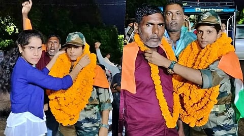 Image of UP NCC cadet Nagma being welcomed by her family and the people of her village with garlands