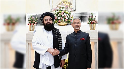 Foreign ministers of Afghanistan and India shake hands in New Delhi
