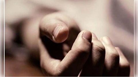 A close-up of a relaxed hand resting on a blurred surface, fingers gently curled. The soft lighting creates a calm, serene atmosphere.