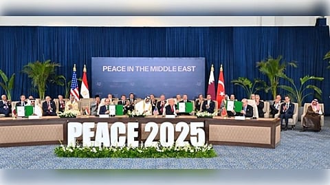 The Middle East peace conference is underway, featuring a large sign that highlights the event's purpose and goals.