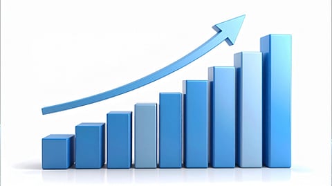 A 3D blue bar graph displaying a steady upward trend. Each bar increases in height from left to right, with an upward arrow above indicating growth.