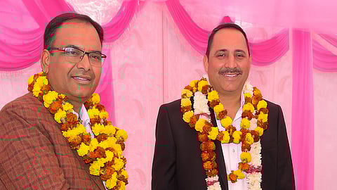 Subhash Bijarani and Ranveer Bijarani the people who have scam wearing coat and garlands in their neck