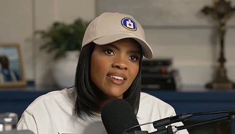 Candace owens wearing cap and white shirt in a podcast