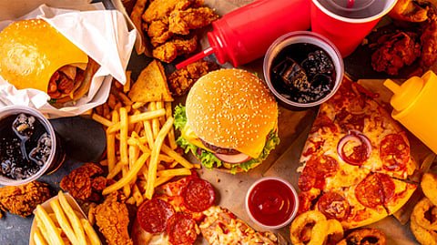 Fast food items displayed, highlighting their role in contributing to obesity and unhealthy eating habits