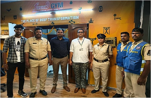In the image police officers are shown in front of a office namd The place of Body Transformation
