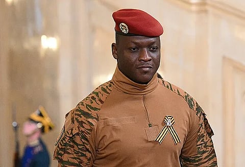 Ibrahim Traoré, the President of Burkina Faso, standing in official army fatigues.